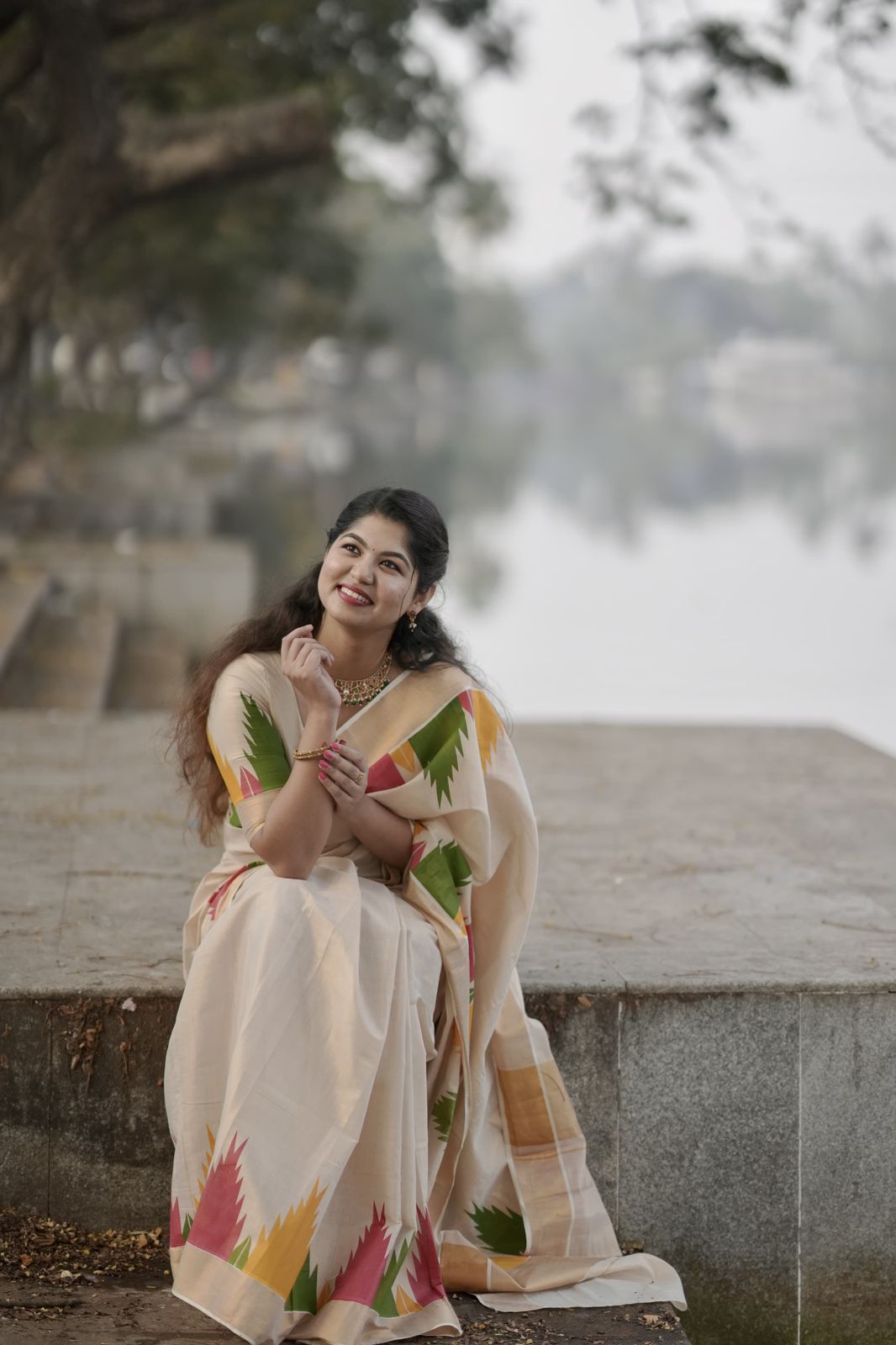 Golden tissue multi color temple saree